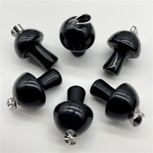 Detail view of mini black crystal stone mushroom pendants for DIY jewelry making accessories.