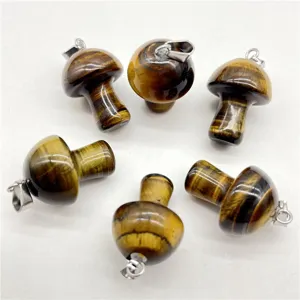 Natural tiger's eye stone mini mushroom pendant detail view, crystal jewelry making charm.