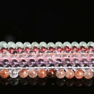 Natural crystal gemstone beaded bracelets collection showing colorful quartz and multi-stone round beads.