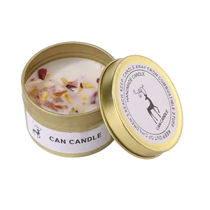 Aromatherapy scented candle in gold tin with crystal stones and dried flowers for home decor.