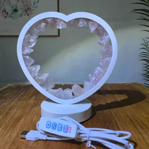 Heart-shaped raw rose quartz LED table lamp crystal night light with USB controller for desk decor.