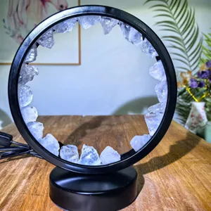 Close-up view of the natural crystal raw stone LED table lamp with a chic black metal frame.