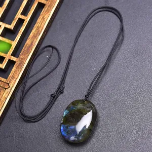 Natural Labradorite gemstone pendant necklace with black hand-woven rope chain jewelry.