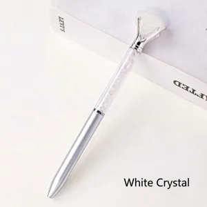Creative crystal ballpoint pen with natural rough white quartz diamond top for office desk.