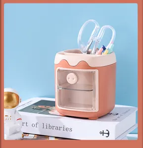 Cute pink pig desktop stationery organizer detail view, multi-grid pen holder with transparent door.
