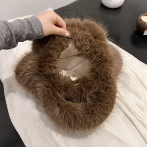 Furry handbag for women winter fashion fluffy plush bucket bag with soft interior lining.