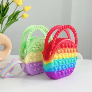 Silicone pop-it heart handbag detail view showcasing rainbow colors and textured bubble surface.
