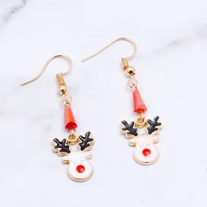 Close-up detail shot of cute Christmas reindeer enamel hook earrings featuring gold tone.