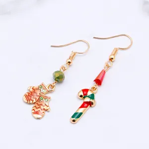 Christmas asymmetric dangle earrings featuring cute mittens and candy cane charms.