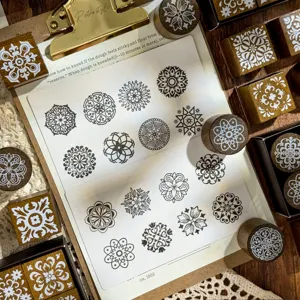 Wooden stamp set with vintage floral carved patterns for DIY journaling and craft art.