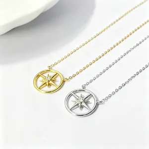 Close-up of S925 sterling silver and gold compass eight-pointed star pendant necklaces.
