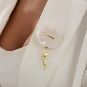 Elegant white shell flower brooch detail, chic gold stem metal pin for women fashion.