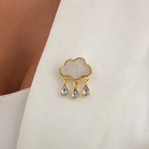 Exquisite close-up detail of the creative cloud rhinestone tassel brooch sparkling gracefully.
