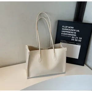 Minimalist soft leather tote bag, large capacity shoulder bag for women daily commute style.