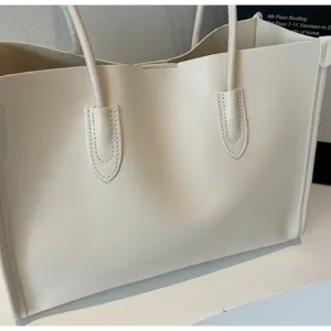 Minimalist off-white soft leather tote bag, large capacity shoulder handbag for daily use.