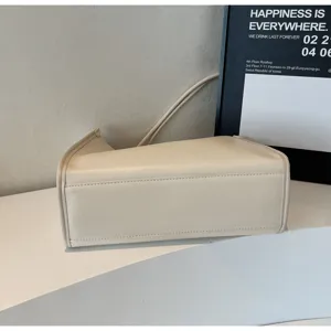 Minimalist beige shoulder bag for women, soft PU leather large capacity tote purse daily use.