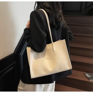 Detailed view of soft leather tote bag, solid color large capacity shoulder underarm bag.