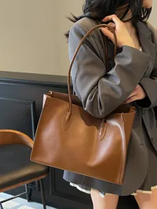 Brown leather tote bag for women, large capacity stylish shoulder underarm bag daily use.