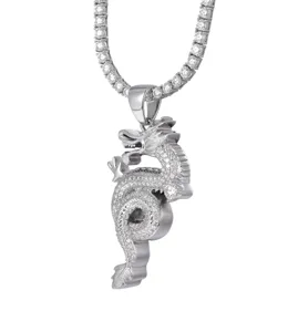 Detailed close-up view of a silver-plated hip-hop dragon pendant with shimmering tennis chain.