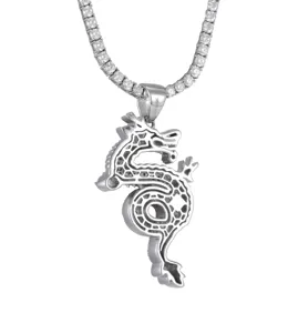 Close-up of silver dragon pendant, detailed stone setting and S925 engraved bail design.