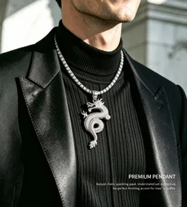 Detailed view of men's iced out dragon pendant necklace in silver tone, sparkling pavé design.