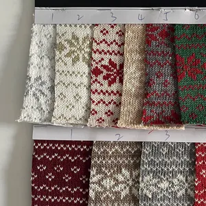Detailed view of Christmas jacquard knit fabric swatches with Nordic snowflake patterns for crafts.
