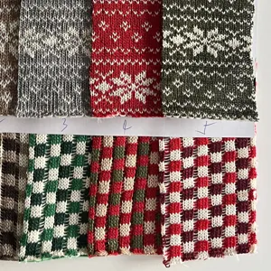 Christmas jacquard knit fabric detail with classic snowflake and plaid patterns for crafts.