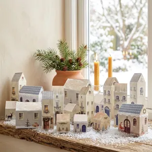 Detail shot of Nordic Christmas paper house advent calendar village set, festive decor props.