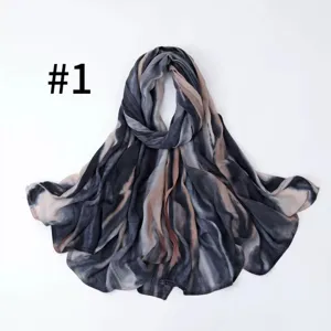Detailed close-up view showcasing the soft satin silk tie-dye stripe scarf design.