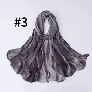 Detail view of the soft gradient silk-feel long scarf, showing the fine drape texture clearly.
