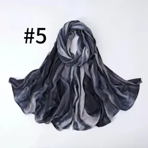 Detail shot of a gradient striped soft breathable silk-like scarf, elegant drape texture.