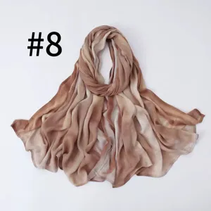 Detailed view of brown gradient stripe faux silk scarf, soft and breathable fabric texture.