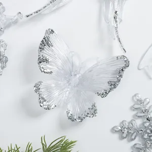 Clear acrylic butterfly Christmas tree ornament featuring silver glitter main product view