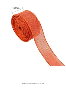 Détail de ruban en jute orange avec texture fine et largeur 3.8cm pour déco d'automne.