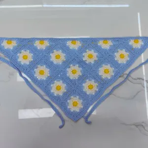 Handmade crochet floral bandana with daisy granny squares and blue ties for women.