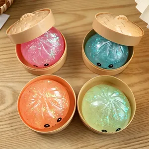 Cute glitter bun squishy toy with mini steamer basket, soft stress relief toy for creative fun.