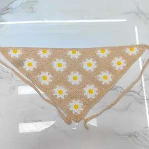 Detailed view of the cute crochet daisy floral triangle bandana hair scarf with ties.