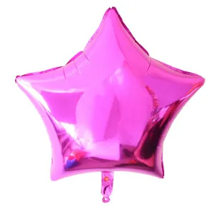 Pink star foil balloon detail view, glossy metallic surface ideal for party celebrations.