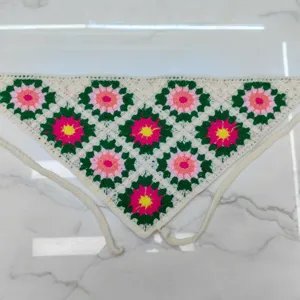 Detailed view of handmade crochet floral triangle headscarf, colorful knitted bandana hair accessory.