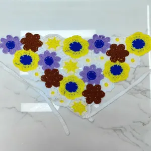 Handmade crochet floral bandana detail view, colorful knitted triangle hair scarf for women.