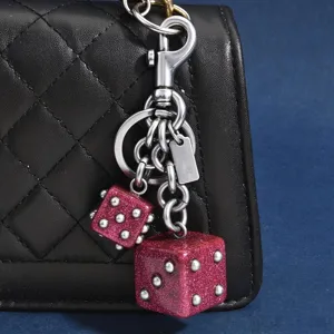 Mignon porte-clés double dés rose pailleté charm de sac accessoire élégant en métal