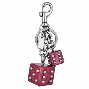 Porte-clés double dés pailleté, charm de sac en métal élégant et pendentif pour accessoire chic.