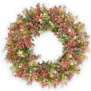 Detailed close-up of artificial eucalyptus wreath showing realistic leaf texture and colors.