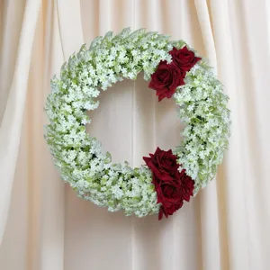 Exquisite artificial flower wreath featuring eucalyptus and red roses for home wall decor.