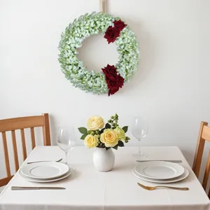 Artificial eucalyptus wreath with baby's breath and red roses for home and wedding decor detail.