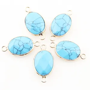 Connecteurs de pierre ovales turquoise bleue à double anneau pour fabrication de bijoux.