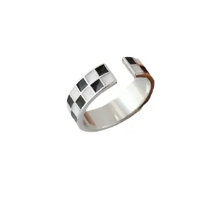 Silver open ring featuring a chic black and white checkerboard grid design for women.