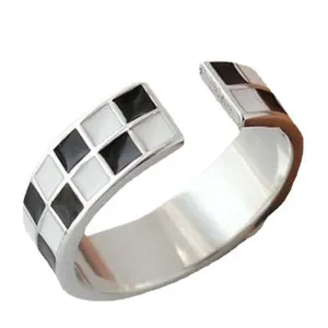 Vintage black and white checkerboard open ring for women, stylish geometric metal jewelry.