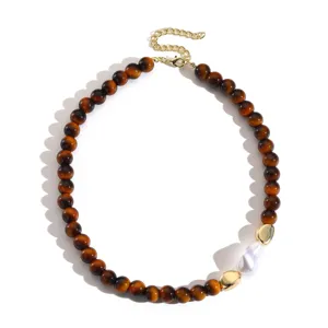 Vintage tiger eye bead necklace with irregular pearl and gold metal accents for women.
