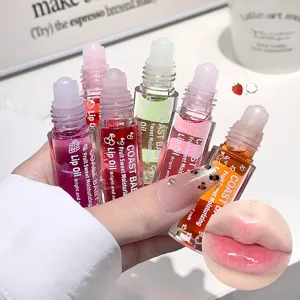 COAST BABY aceite de labios roll-on hidratante afrutado para labios brillantes y jugosos.